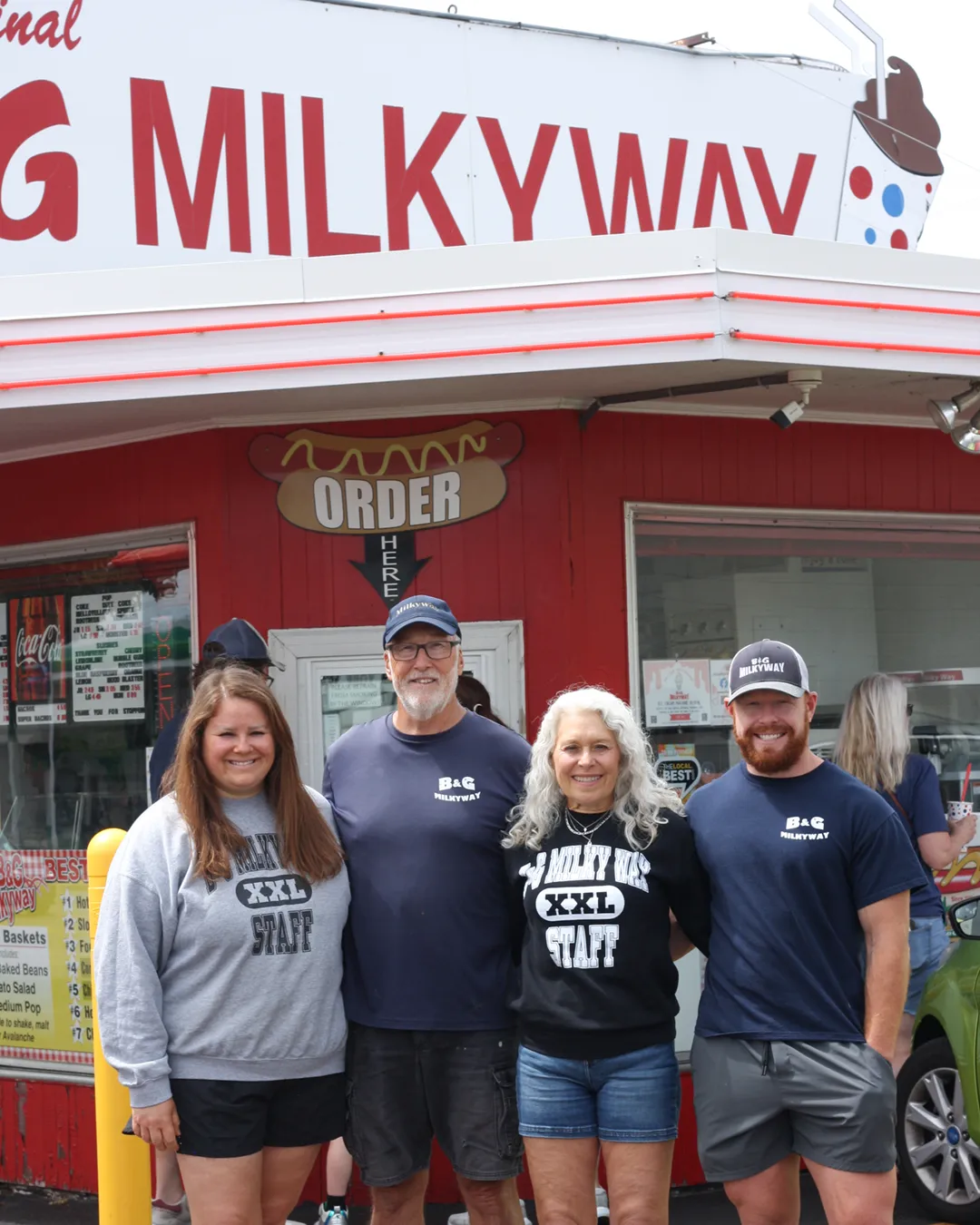 The B & G Milkyway owners in front of the original 12th St store.